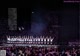 A group of people standing on top of a stage.