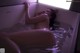 A naked woman laying in a bathtub in the water.